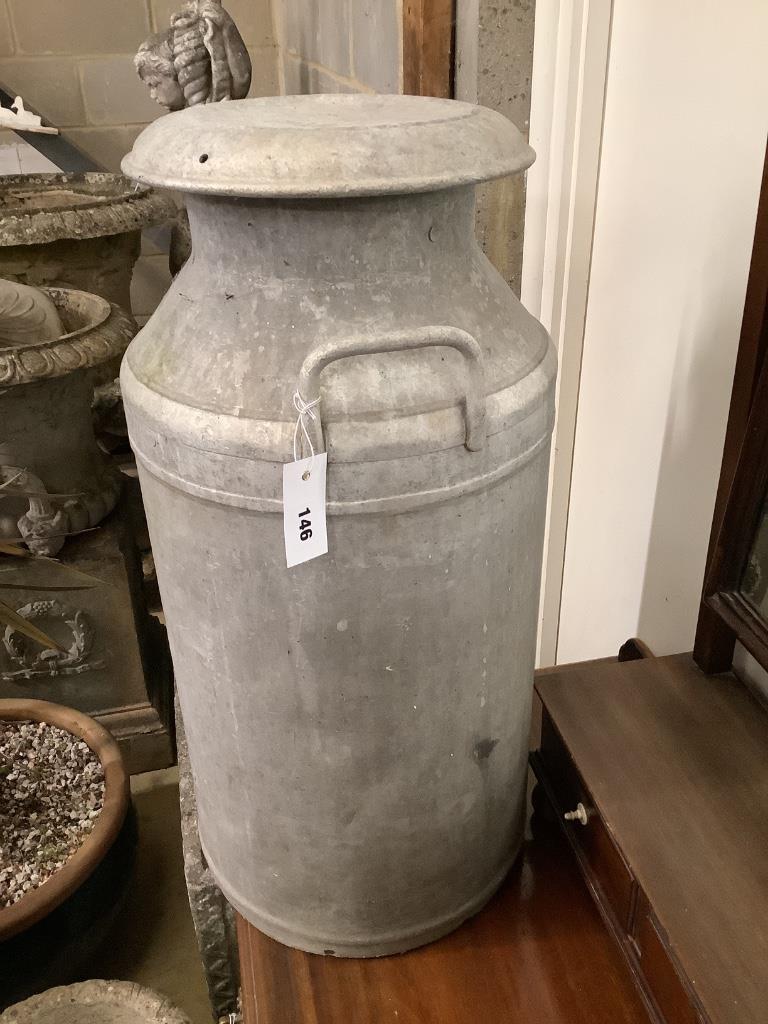 A vintage galvanised milk churn, height 70cm